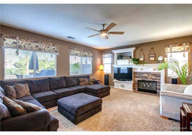 1909 Lagrange Road Chula Vista, CA 91913 - Photo 8 of 25 Spacious family room with ceiling fan, built-in media center, custom fireplace, and built-in surround sound with speakers.