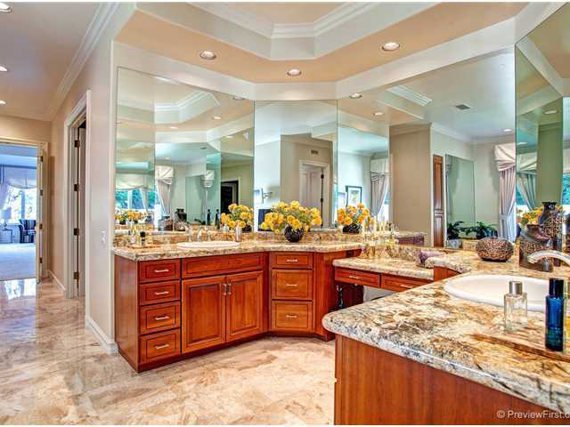 17036 Circa Del Sur Rancho Santa Fe, CA 92067 - Photo 10 of 25 The master bath has been richly appointed with rich cabinets, stone floors, granite counters, moldings and custom fixtures.