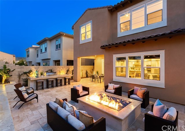 67 Swift Irvine, CA 92618 - Photo 2 of 44 Beautifully completed backyard with bbq island, fire glass pit, and travertine tiles