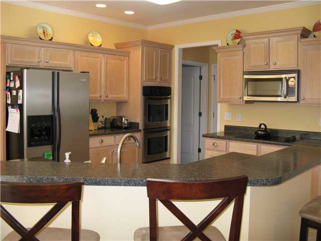4851 Rainy Pass Road Collierville, TN 38017 - Photo 5 of 12 Spacious kitchen has an octagon shaped breakfast bar that overlooks the hearth room and breakfast area.