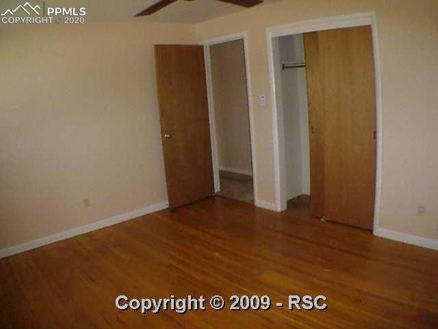 1320 Sunset Road Colorado Springs, CO 80909 - Photo 7 of 16 Master Bedroom has Spacious Closet & Ceiling Fan