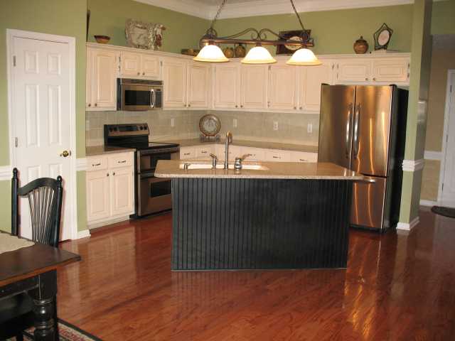 Everything updated and sparkling!  Perfect for entertaining.....Maytag double oven and silestone counters with tile backsplash....