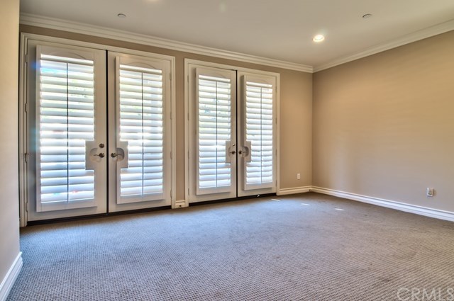 2148 Sageleaf Circle Corona, CA 92882 - Photo 30 of 74 This is another angle of the bonus/game room. The 2 sets of French doors in the picture lead to the front balcony. There's another set of French doors on the south side that leads to a much larger balcony.