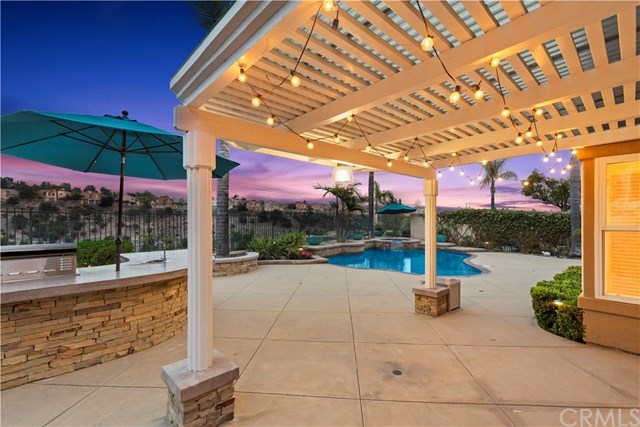 16 Flores Lake Forest, CA 92610 - Photo 9 of 24 Paradise awaits only steps outside of your family room door. This home is perfect for entertaining, or quiet evenings at home.