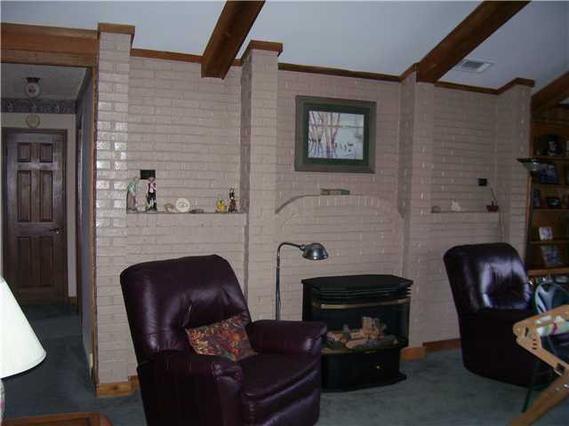 8979 Tracy Road Atoka, TN 38004 - Photo 2 of 12 Greatroom is very large in size and open to the Dining and Kitchen, my client currently has her Quilting rack on one end and will be finished with it soon! I'll get some additional pictures when complete. No fireplace just a gas line for a free standing