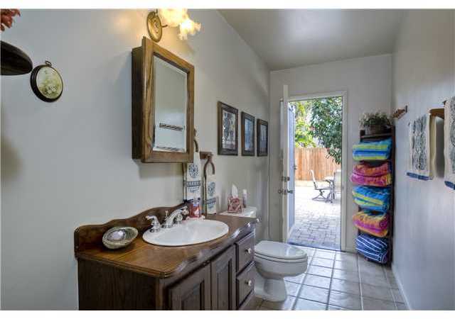 308 Alviso Way Encinitas, CA 92024 - Photo 19 of 25 This is one of two hall bathrooms; this one has a door leading to the backyard...perfect for entertaining with the fire pit and pool.