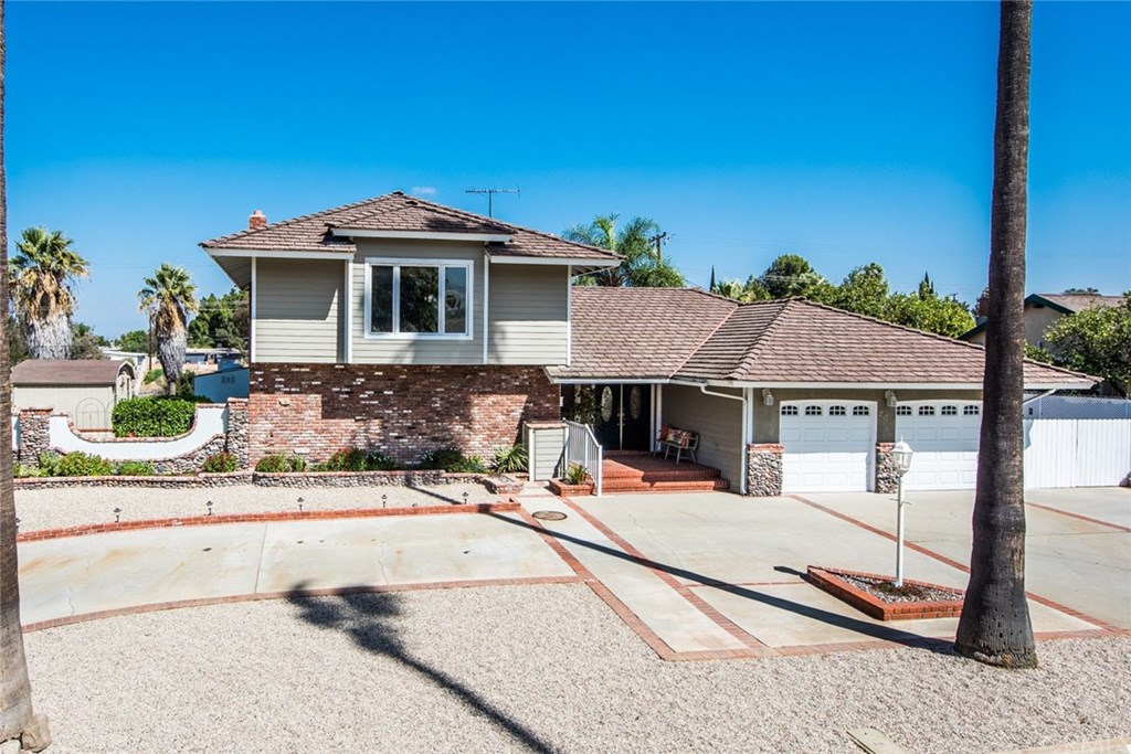 2001 Cypress Point Drive Corona, CA 92882 - Photo 3 of 62 Beautiful planters, use of brick, Hardie board siding, too much to list for this welcoming home