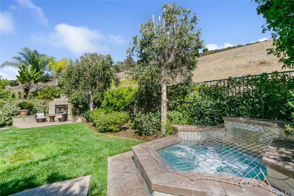 46 Rolling Ridge Rancho Santa Margarita, CA 92688 - Photo 26 of 26 Why not enjoy the in-ground spa, next to nature?