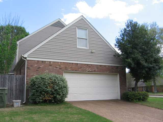 8516 Dulwich Road Memphis, TN 38016 - Photo 14 of 20 The side entrance garage holds two cars and has a well-organized work area. The driveway is off of a cove.