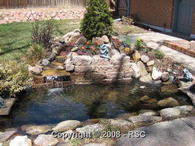 1908 North Chelton Road Colorado Springs, CO 80909 - Photo 15 of 16 The backyard oasis includes a pond with a flowing streambed