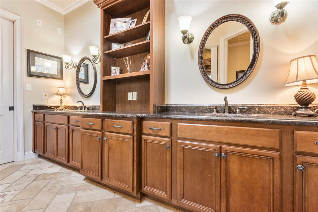 157 Cottage Grove Collierville, TN 38017 - Photo 10 of 23 Notice all the custom cabinet space and large granite double sinks. Perfect for storage in the master bath.