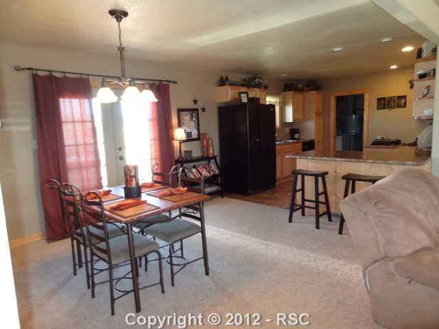 29 Ridge Point Circle Divide, CO 80814 - Photo 4 of 16 Dining area off the kitchen and living room, has a sliding glass walkout to the rear deck and back yard.