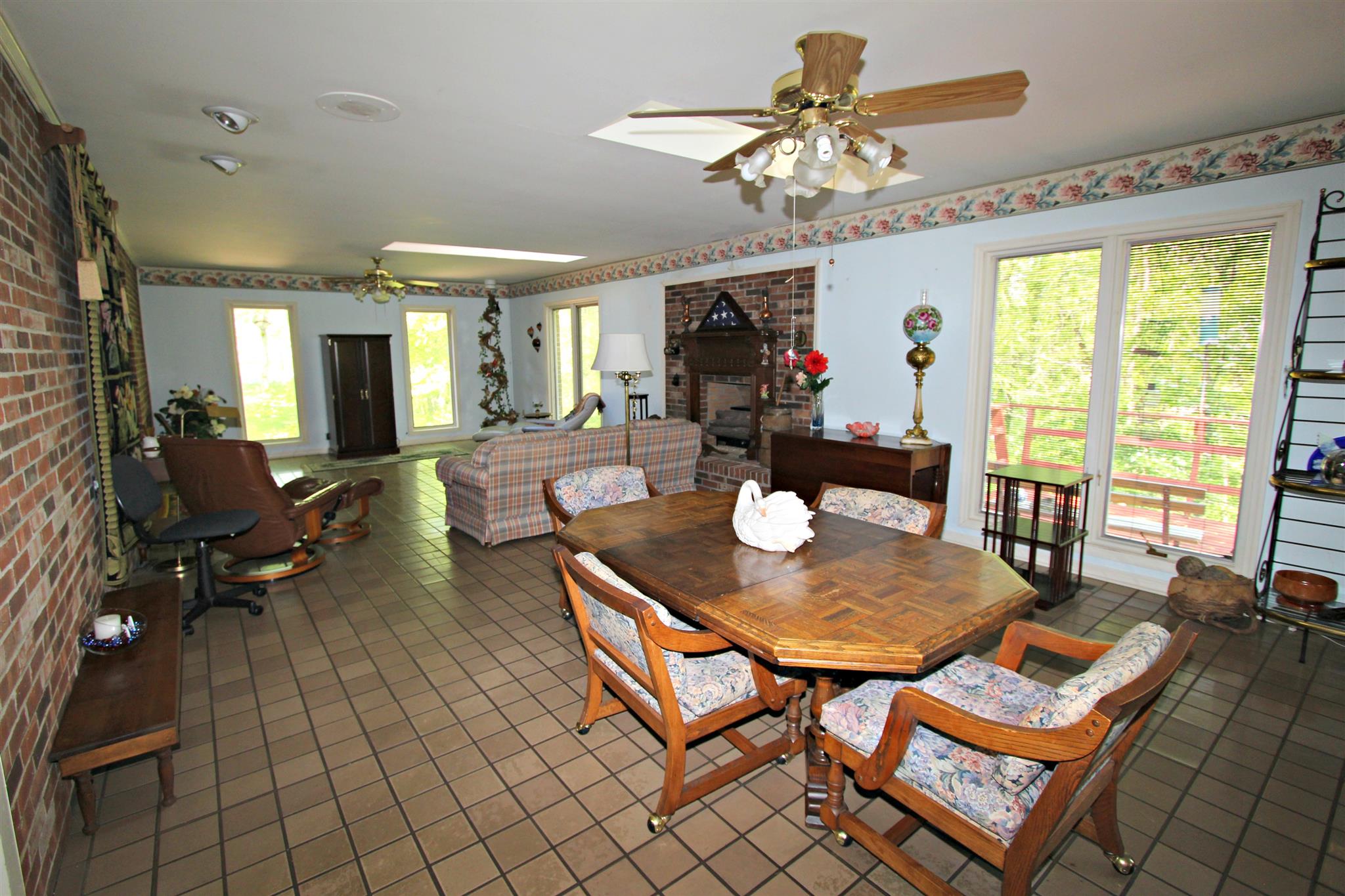 300 Kippsford Pond Road Columbia, TN 38401 - Photo 16 of 36 Den and casual dining area at the back of the house is tiled and features large windows looking out to backyard.