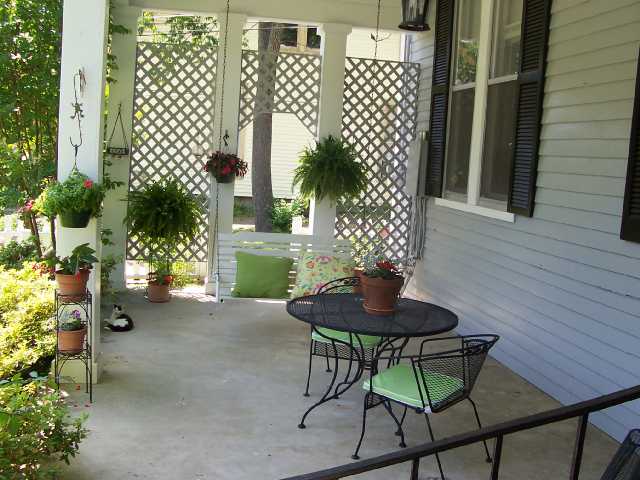 311 North Maple Street Covington, TN 38019 - Photo 2 of 10 WHAT A WONDERFUL PORCH! WITH MORNING SUN/AFTERNOON SHADE, YOU CAN ENJOY SWINGING AT MOST ANY TIME OF THE DAY.