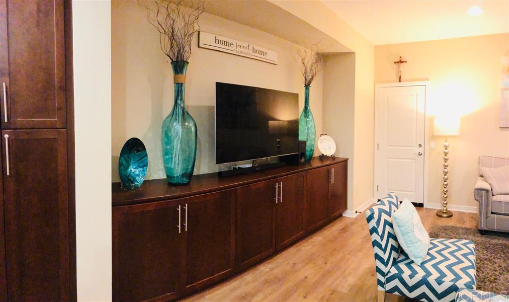 17 Alzada Street Rancho Mission Viejo, CA 92694 - Photo 7 of 20 Upgraded entertainment builtin with matching stained shaker cabinet storage