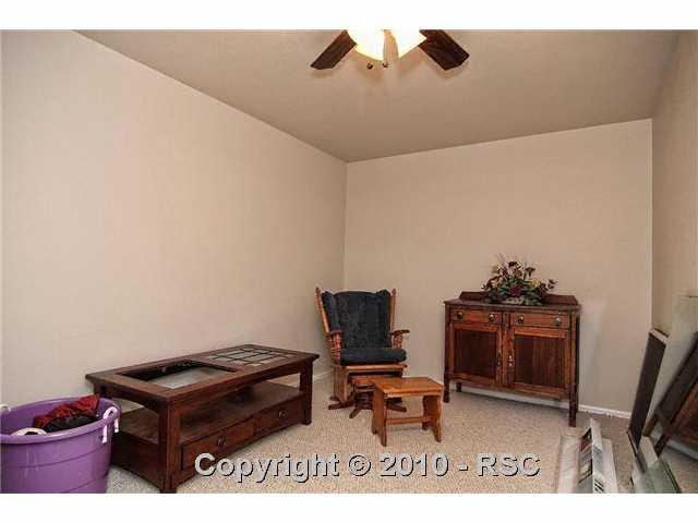 7943 Buschborn Road Peyton, CO 80831 - Photo 11 of 16 One of two finished storage areas in basement.