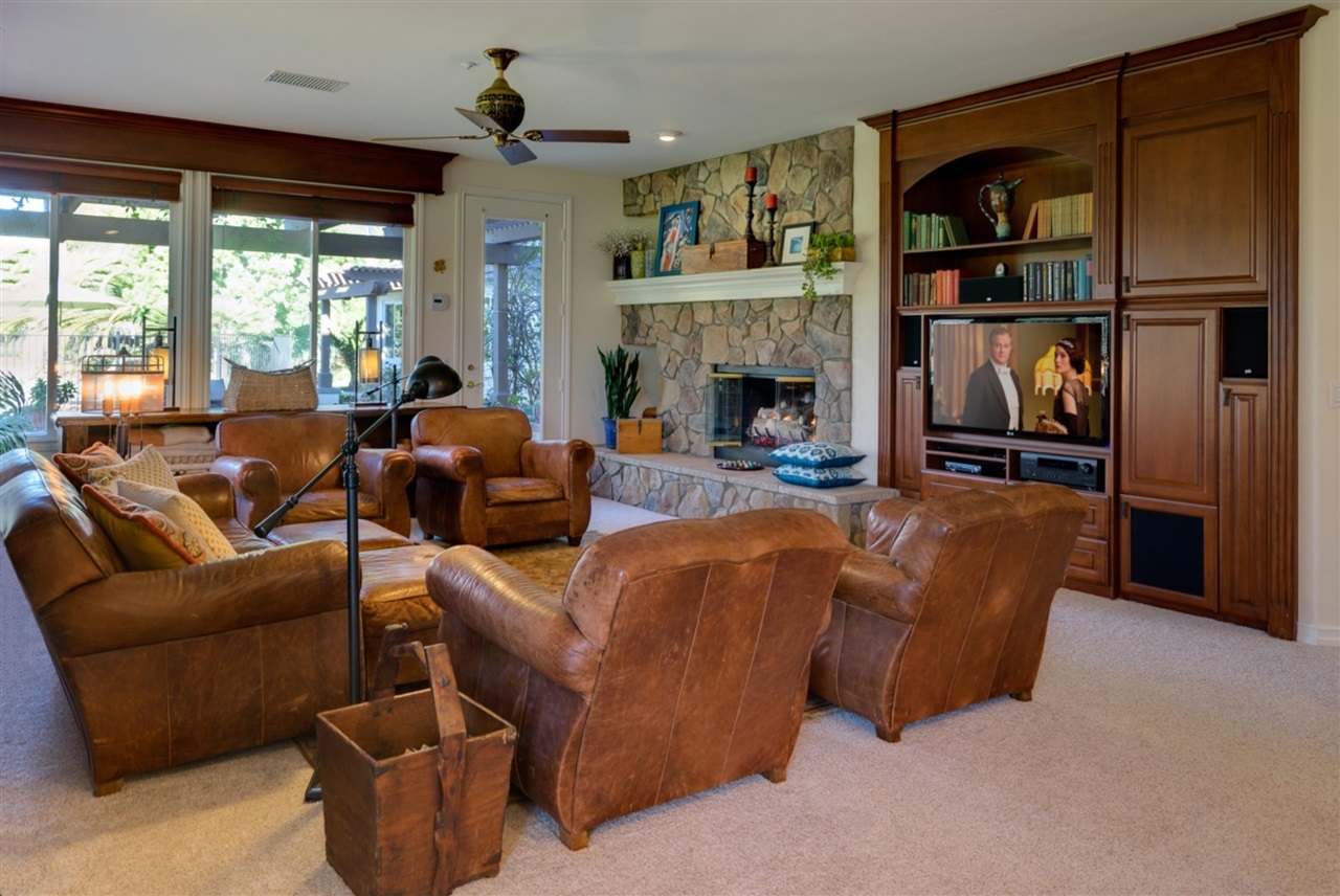 6723 Rancho Lakes Court Rancho Santa Fe, CA 92067 - Photo 9 of 25 Spacious family room with views of the gated pool & spa.