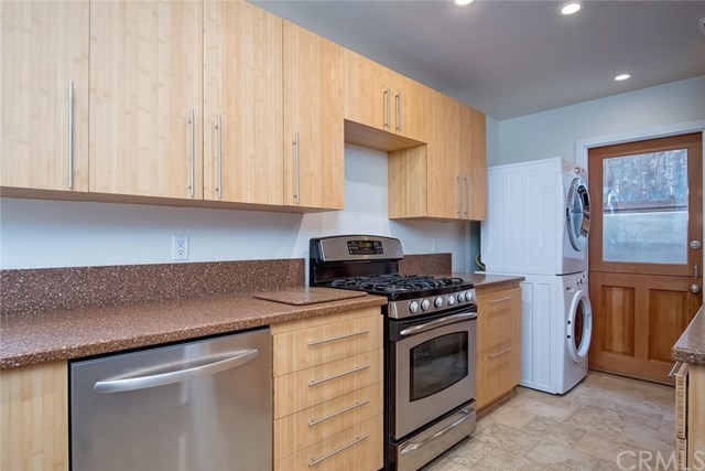 34096 El Contento Dana Point, CA 92629 - Photo 15 of 43 Remodeled Kitchen with custom bamboo cabinetry, stainless steel appliances and douglas fir side entry dutch door. *Download 4 page Features list PDF for more details.