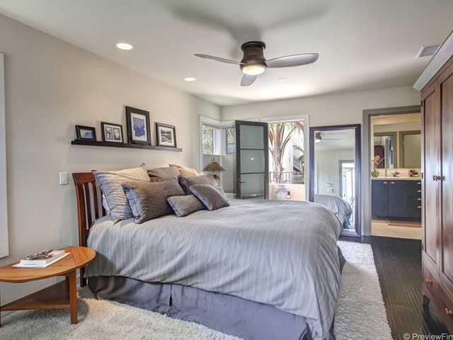 844 3rd Street Encinitas, CA 92024 - Photo 12 of 25 The master bedroom has an ensuite bathroom and a large walk-in closet with built-in cabinetry.
