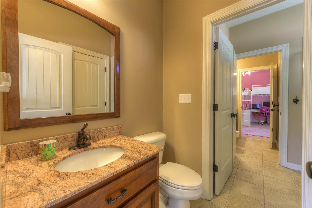 327 Fletcher Road Collierville, TN 38017 - Photo 18 of 25 Heated tile flooring in the downstairs Jack&Jill Bath - each side has a private powder room designated for Bedrooms 2 & 3.