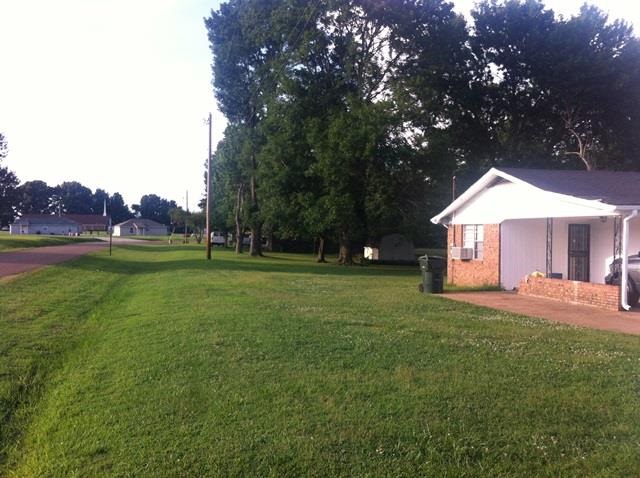 354 Wortham Road Covington, TN 38019 - Photo 3 of 13 Left side view of large corner lot
