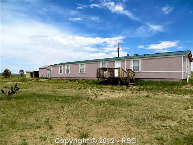 This clean, comfortable and cozy home is located on 40 acres with an amazing view of Pikes Peak!