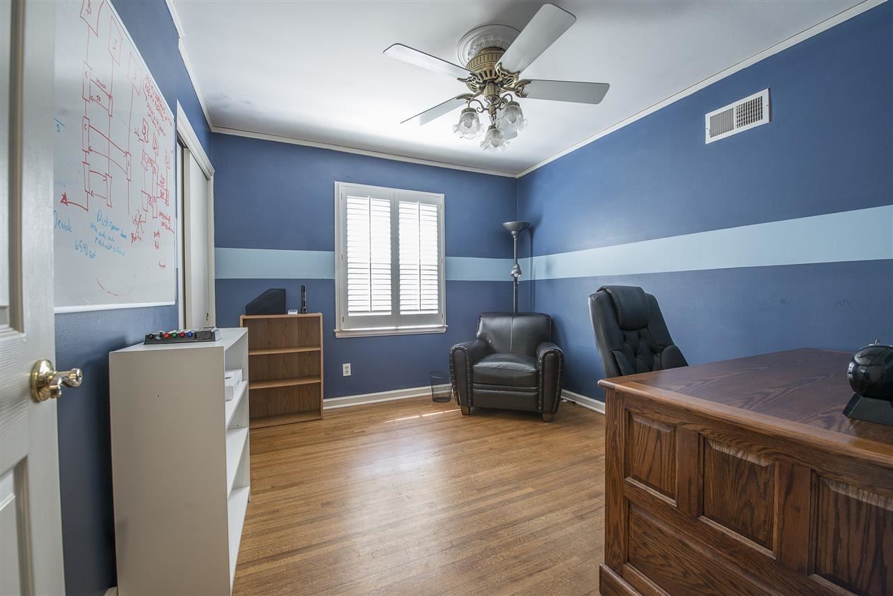 52 Fernway Road Memphis, TN 38117 - Photo 21 of 25 This bedroom is currently being used as an office and is across the hall from the bathroom. Lots of natural light, hardwood floors, ceiling fan and closet with sliding doors.