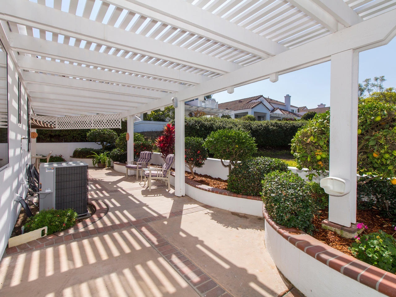 6047 Piros Way Oceanside, CA 92056 - Photo 22 of 25 The patio wraps around almost the entire property with access to the front courtyard on one side as well as a large side yard for storing your outdoor items on the other side of the home.