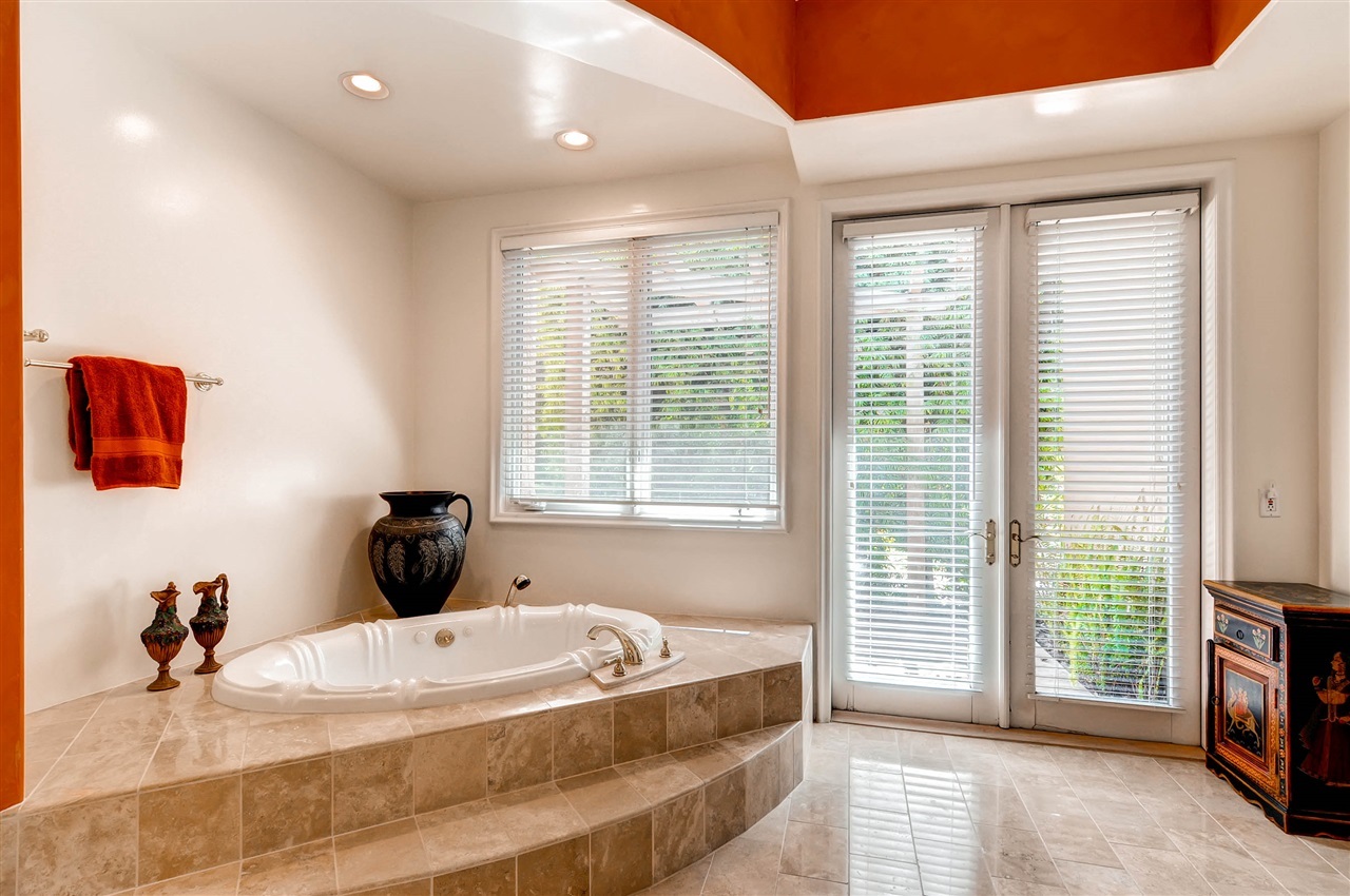 14888 Las Mananas Rancho Santa Fe, CA 92067 - Photo 21 of 25 Picture yourself bathing in this deep soaking tub, relaxing to the sound of the water feature with the french doors open to the sounds of nature - aaahhhhh.