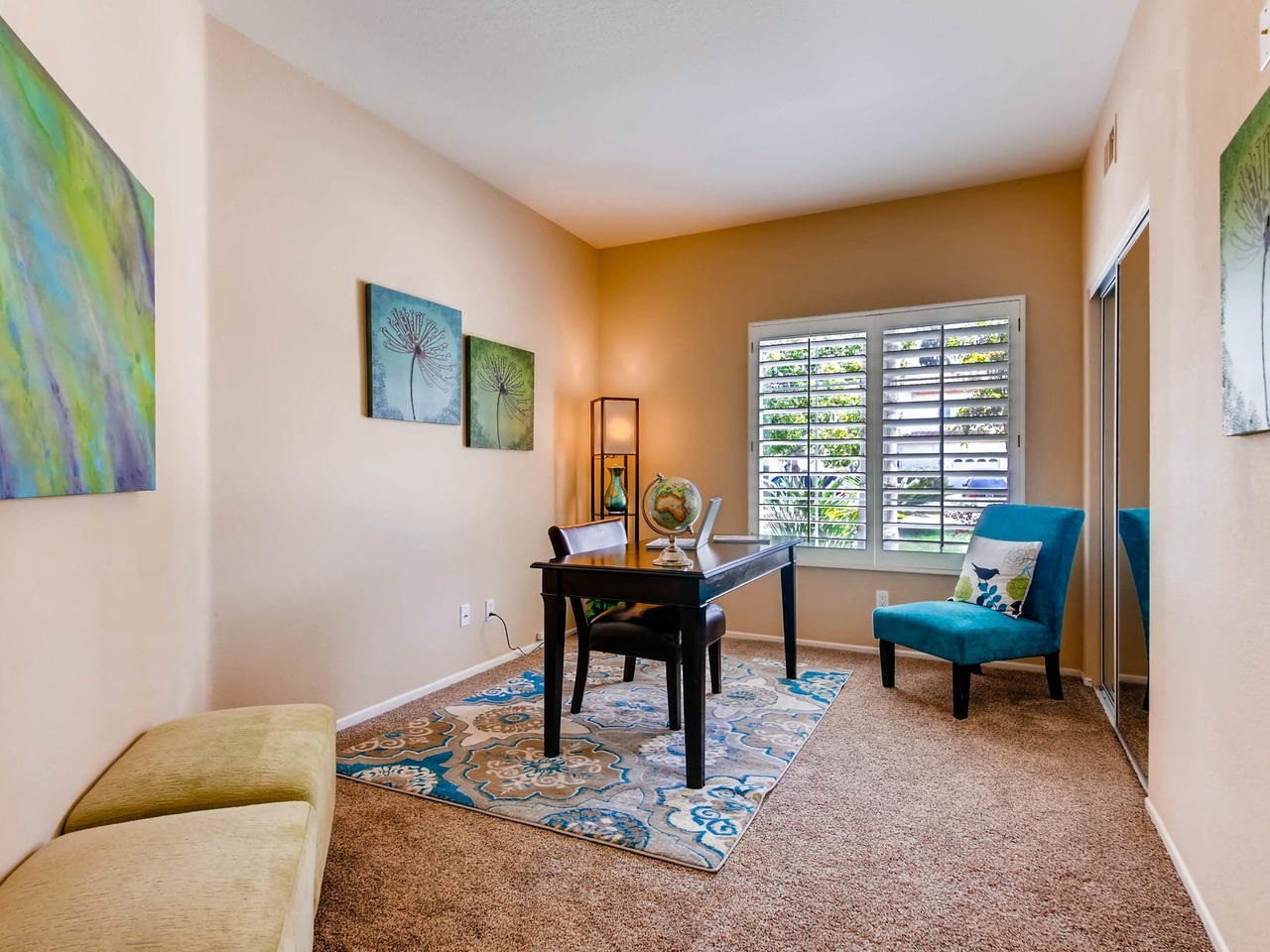 1657 Del Mar Road Oceanside, CA 92057 - Photo 9 of 19 1st floor bedroom with mirrored closet doors currently staged as n office next to 1st floor full bath