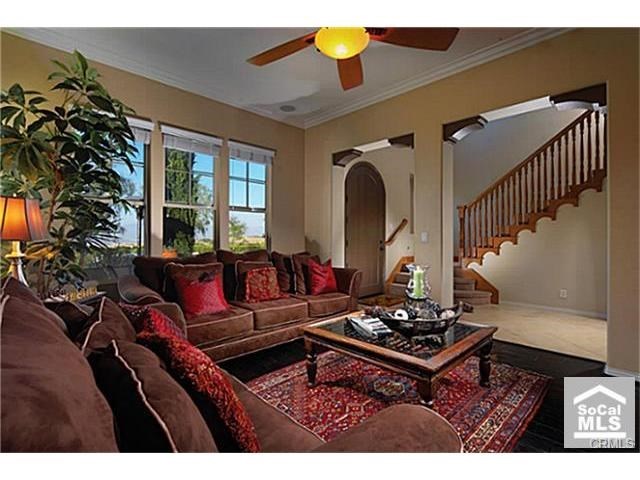 4 San Sovino Newport Coast, CA 92657 - Photo 3 of 8 Designer Appointments include stone and hardwood flooring, crown molding and each room faces the mountain and city light views.