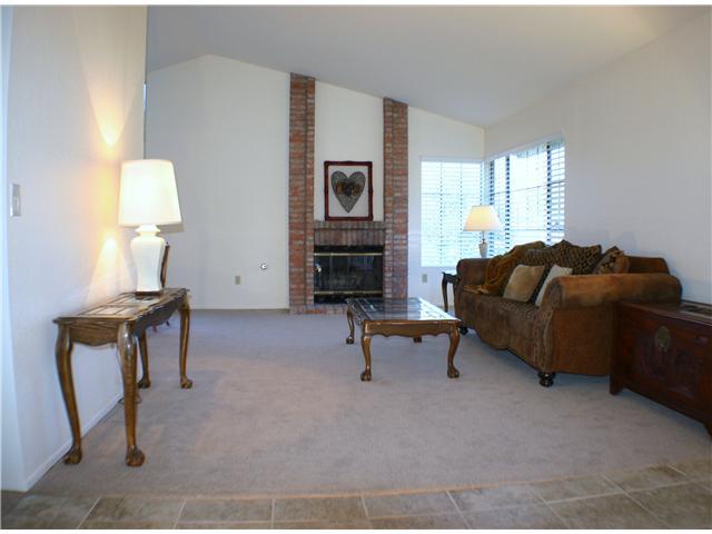 1536 Village View Road Encinitas, CA 92024 - Photo 3 of 22 Vaulted Ceilings in Bright, Open Living Room with Fireplace, new Carpet, Paint and Tile throughout.