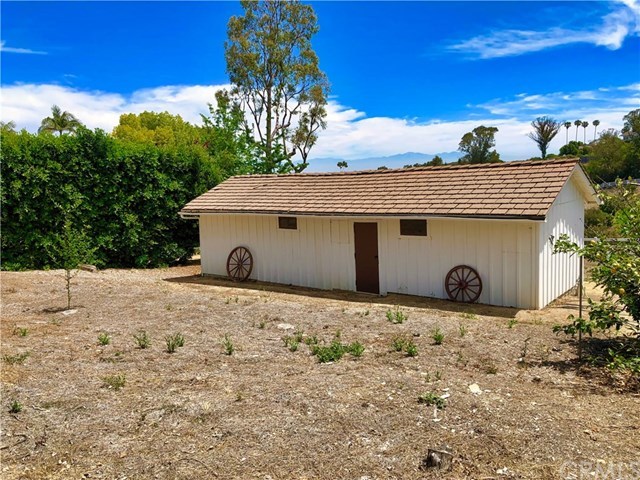 10 Flying Mane Road Rolling Hills, CA 90274 - Photo 4 of 18 Classic two stall barn with 10x10 stalls and Feed and Tack area. There is direct access along the side easement to ride up to Flying Mane or down an easy trail to Crest. Owners had an orchard in front originally and horses in back by the stall doors. This is potentially one of two areas that could be expanded.