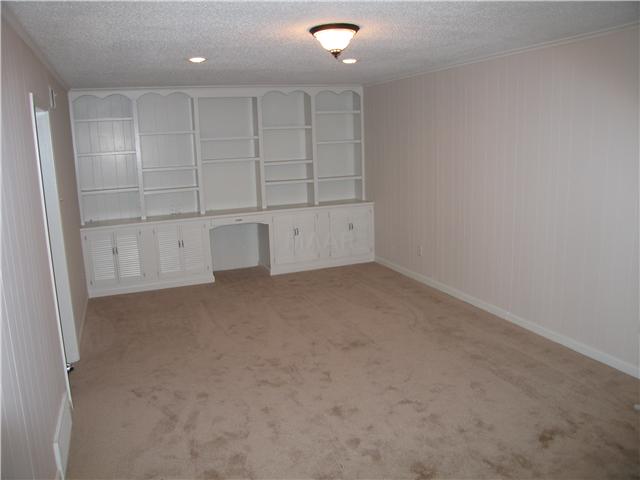 8575 Walnut Grove Road Memphis, TN 38018 - Photo 4 of 12 Very spacious Den/Great room with fresh paint,new carpet ,custom built in bookcase and Fieplace!