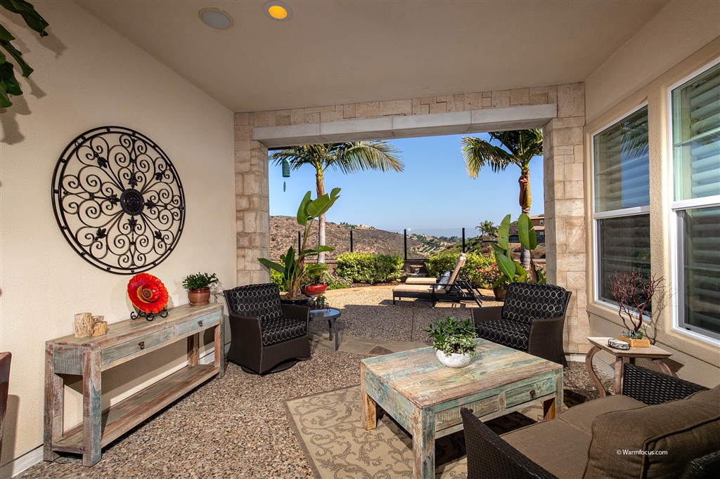 7091 Sitio Caliente Carlsbad, CA 92009 - Photo 6 of 23 Covered Loggia perfect for enjoying both Hot Summer Days and Cool Winter Nights!