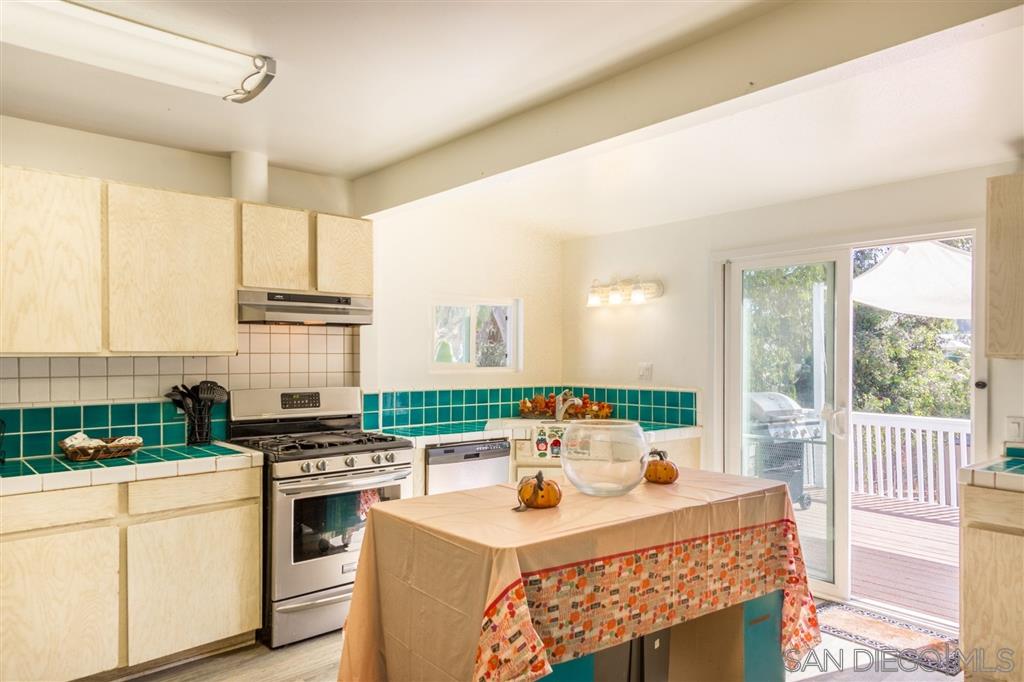 1089 Crest View Road Vista, CA 92081 - Photo 10 of 25 Bright, open kitchen connects to living room and back porch