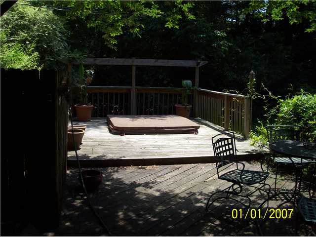 5689 Normandy Road Memphis, TN 38120 - Photo 11 of 13 Inviting deck with Hot Tub. Rear lot Retaining wall adds privacy.