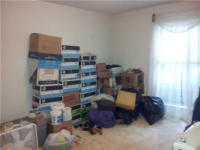 3283 Canisbay Road Memphis, TN 38128 - Photo 12 of 17 This very large bedroom has carpet and a large picture window allowing natural light in. Great closet space too. Owner is storing items here as they pack because this 15x11 bedroom can hold a lot!