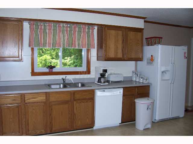 1864 Bringle Road Covington, TN 38019 - Photo 2 of 9 Oak cabinets and tile floor