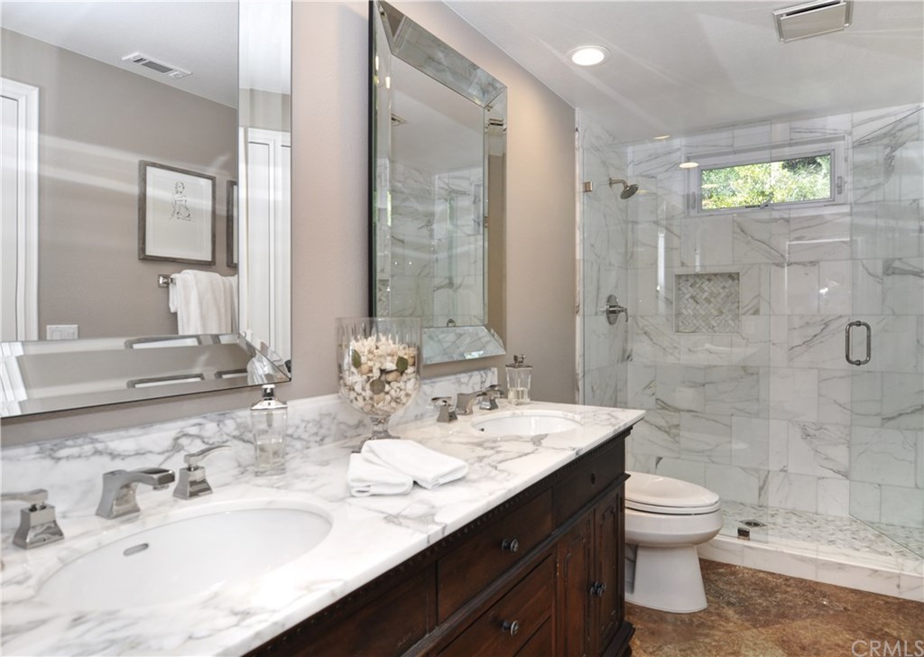7 Estates Drive Villa Park, CA 92861 - Photo 27 of 46 Sumptous Restoration Hardware bath with gorgeous Carrera marble on vanity and in custom built shower made to spoil your guests.