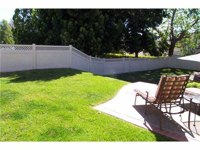 13250 Vinter Way Poway, CA 92064 - Photo 16 of 20 Back yard showing the patio off the master bedroom. A two-tiered back yard with vinyl fencing. Sit back and relax in this parklike setting.