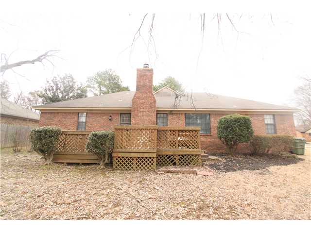 Notice its all brick, with a deck and masonry fireplace.