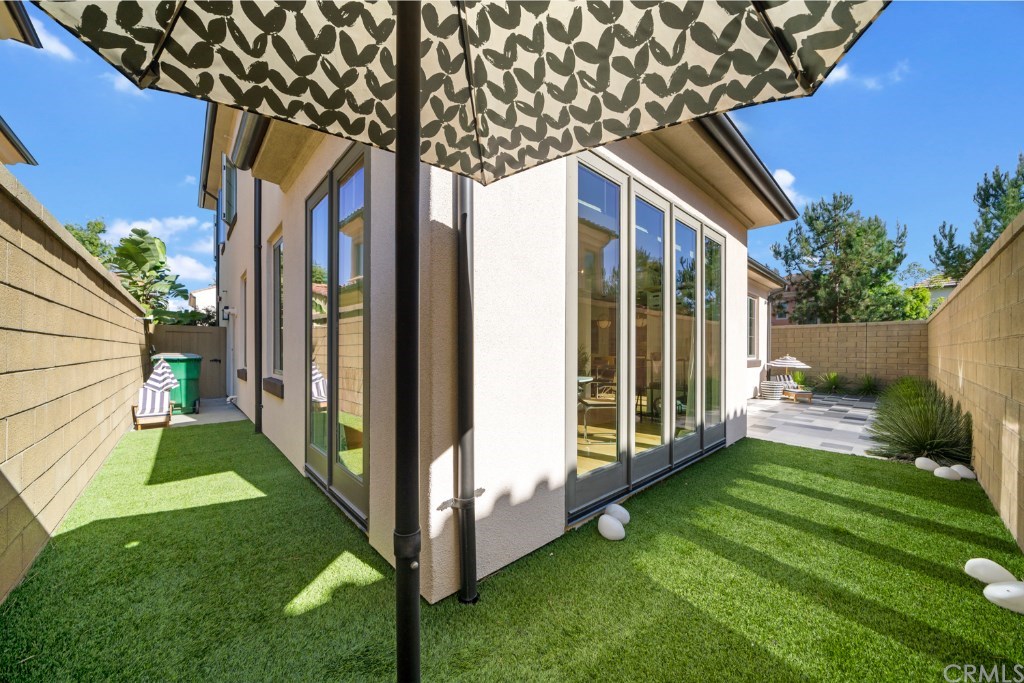 116 Mosswood Irvine, CA 92620 - Photo 32 of 42 Large span of artificial turf is perfect for kids or pets and is easy to maintain.