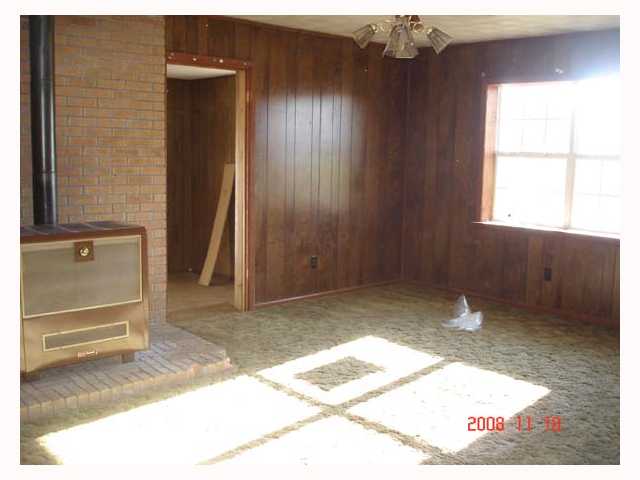192 Jeff Webb Road Ripley, TN 38063 - Photo 2 of 9 View #1 of Living Room - enjoy the warmth of the wood burning stove