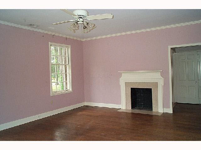 7880 Radford Ridge Road Germantown, TN 38138 - Photo 7 of 10 Large Master Bedroom is washed in light and features a fireplace, hardwood floors and high ceilings & has good closets. It adjoins a master bath with separate shower and tub.