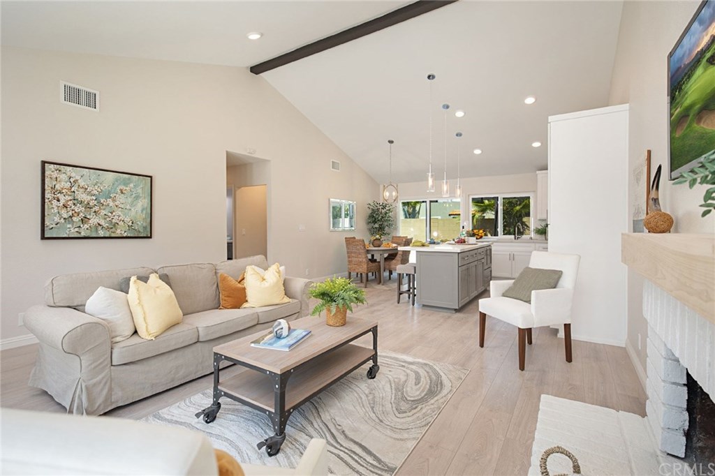 1745 North Bates Circle Anaheim, CA 92806 - Photo 2 of 32 Living room with recessed lighting, fireplace, and vaulted ceilings.