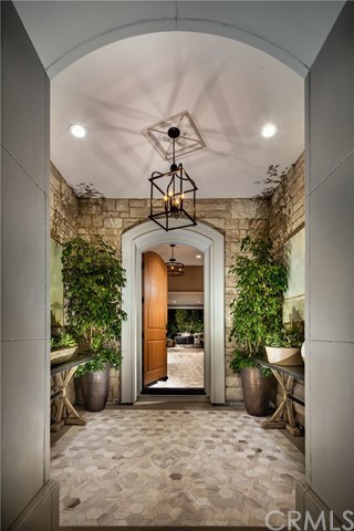 61 Buttonquail Irvine, CA 92618 - Photo 2 of 15 Entry. Photo of model home not actual home for sale.