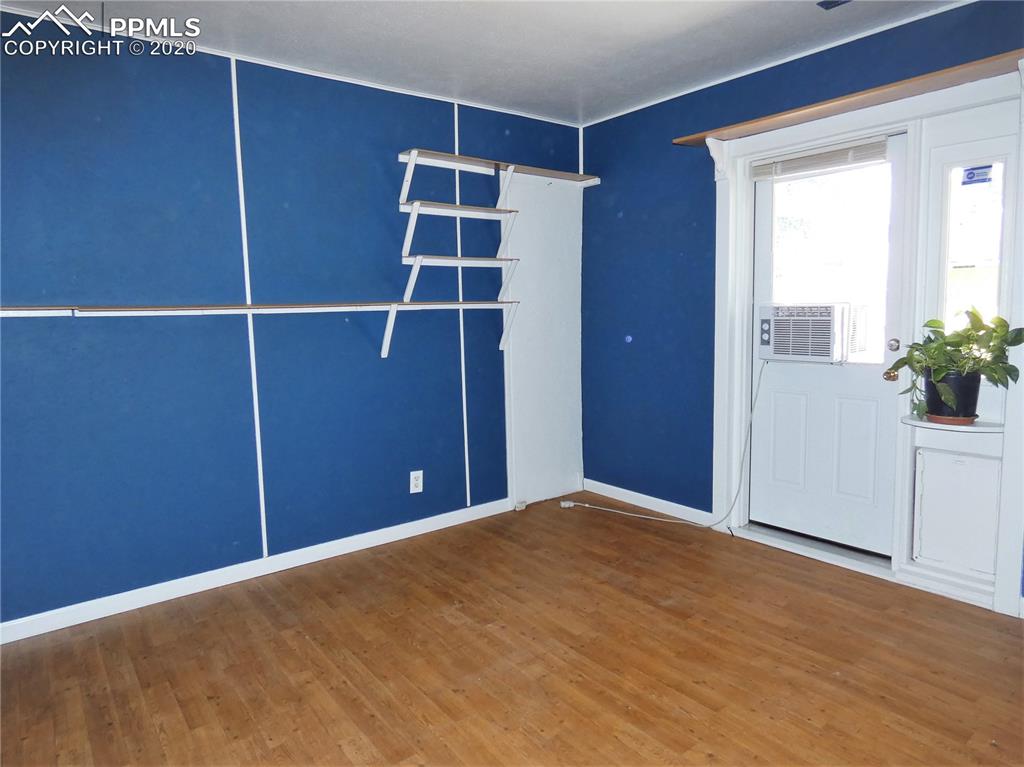 802 Sunset Road Colorado Springs, CO 80909 - Photo 13 of 17 Bedroom with access to backyard