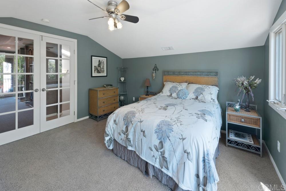 3112 Guajome Lake Road Oceanside, CA 92057 - Photo 16 of 24 Upstairs bedroom French doors to hall library, reading nook, and bathroom.