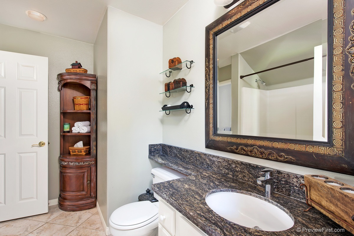 757 Inverlochy Drive Fallbrook, CA 92028 - Photo 16 of 25 Matching honed granite in guest bath, laundry room, as well as window sills in family room and kitchen.